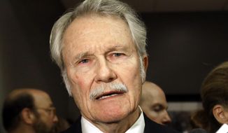 FILE - In this Oct. 10, 2014, file photo, Oregon Gov. John Kitzhaber talks to reporters before a debate in Portland, Ore. The Oregon State Ethics Commission vote unanimously in finding former Gov. Kitzhaber guilty of several ethics violations. The preliminary finding on Friday, Feb. 16, 2018, means that Kitzhaber can appeal. (AP Photo/Don Ryan, File)