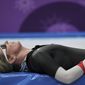 Claudia Pechstein of Germany lays in exhaustion after the women&#39;s 5,000 meters speedskating race at the Gangneung Oval at the 2018 Winter Olympics in Gangneung, South Korea, Friday, Feb. 16, 2018. (AP Photo/Felipe Dana)
