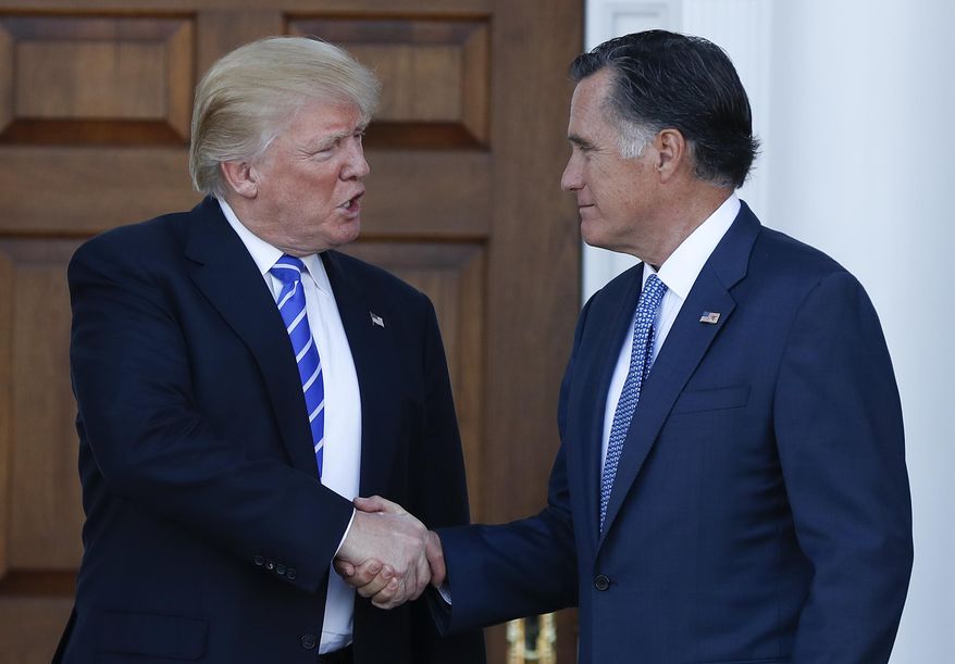 FILE - In this Nov. 19, 2016, file photo, President-elect Donald Trump and Mitt Romney shake hands as Romney leaves the Trump National Golf Club Bedminster in Bedminster, N.J. Romney and Trump exchanged harsh criticisms of one another during the 2016 presidential campaign but also have a history of being willing to sit down with each other when mutually beneficial. Romney's announcement that he's running for the U.S. Senate seat in Utah creates the potential for future battles, or even deal-making. (AP Photo/Carolyn Kaster, File)