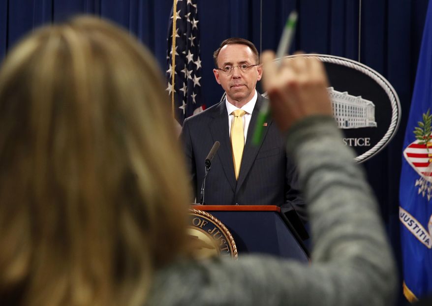 A reporter raises her hands to ask a question of Deputy Attorney General Rod Rosenstein, after he announced that the office of special counsel Robert Mueller says a grand jury has charged 13 Russian nationals and several Russian entities, Friday, Feb. 16, 2018, in Washington. The defendants are accused of violating U.S. criminal laws to interfere with American elections and the political process. (AP Photo/Jacquelyn Martin)