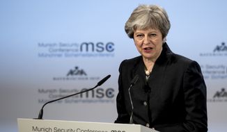 Britain&#39;s Prime Minister Theresa May speaks at the Security Conference in Munich, Germany, Saturday, Feb. 17, 2018. (Sven Hoppe/dpa via AP)