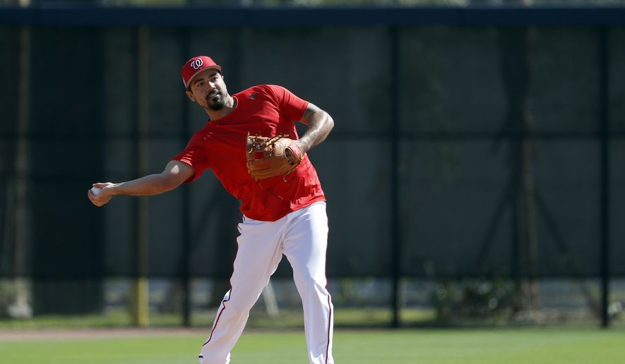 Washington Nationals infielder Anthony Rendon throws during spring training baseball practice Saturday, Feb. 17, 2018, in West Palm Beach, Fla. (AP Photo/Jeff Roberson) **FILE**