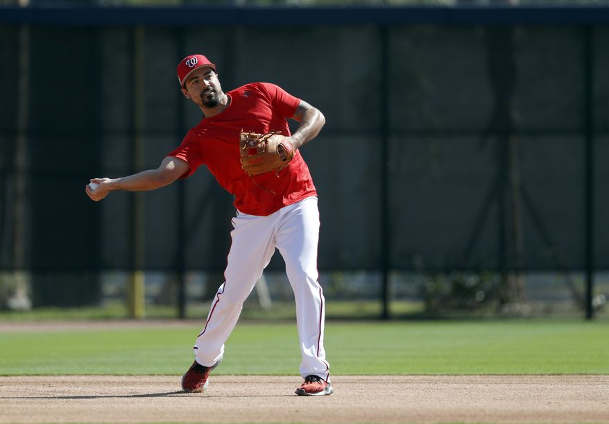 Washington Nationals infielder Anthony Rendon throws during spring training baseball practice Saturday, Feb. 17, 2018, in West Palm Beach, Fla. (AP Photo/Jeff Roberson) **FILE**