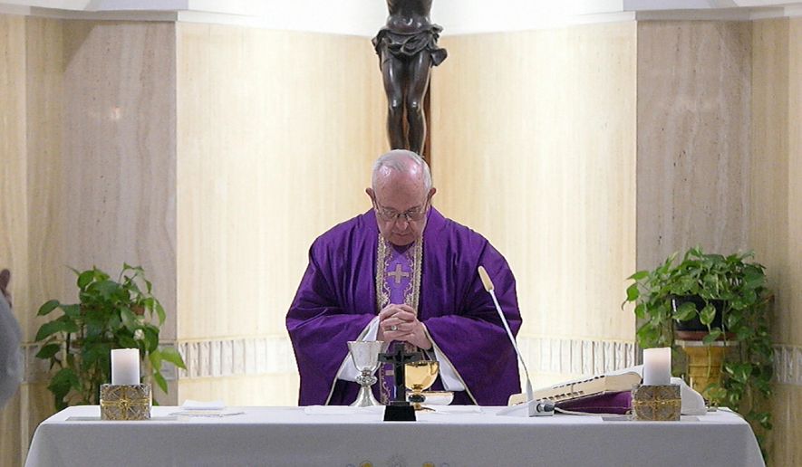 Pope Francis celebrates Mass at the Santa Marta chapel at the Vatican, Friday, Feb. 16, 2018. (L'Osservatore Romano/Pool Photo via AP)