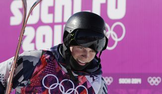 Gus Kenworthy of the United States reacts after his first run  in the men&#39;s ski slopestyle final at the Rosa Khutor Extreme Park, at the 2014 Winter Olympics, Thursday, Feb. 13, 2014, in Krasnaya Polyana, Russia. (AP Photo/Gero Breloer)