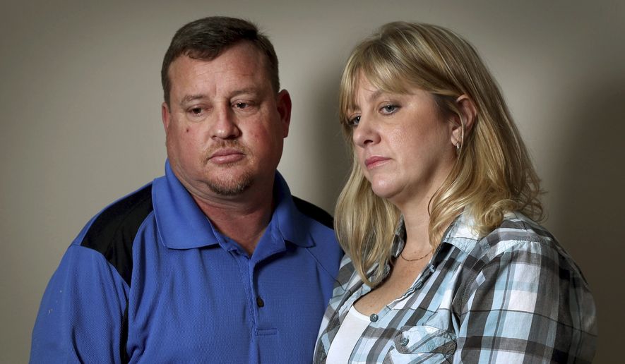 In this Feb. 17, 2018, photo, James Snead and his wife Kimberly appear at an interview about the shooting at Marjory Stonemason Douglas High in Parkland, Fla., where 17 people were killed. The Sneads, who had taken suspected gunman Nikolas Cruz in their home after his mother died, told the Sun-Sentinel newspaper they had no idea the extent of Cruz's issues. (Susan Stocker/South Florida Sun-Sentinel via AP)