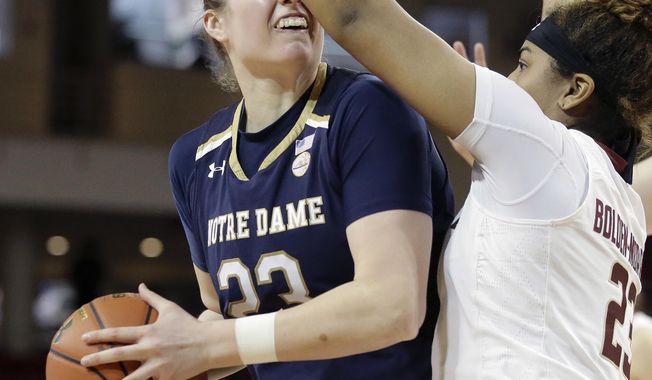 Notre Dame forward Jessica Shepard, left, tries to drive past Boston College guard Milan Bolden-Morris, right, in the second half of an NCAA college basketball game, Sunday, Feb. 18, 2018, in Boston. (AP Photo/Steven Senne)