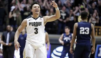 Purdue guard Carsen Edwards (3) celebrates a 76-73 win over Penn State in an NCAA college basketball game in West Lafayette, Ind., Sunday, Feb. 18, 2018. (AP Photo/Michael Conroy)