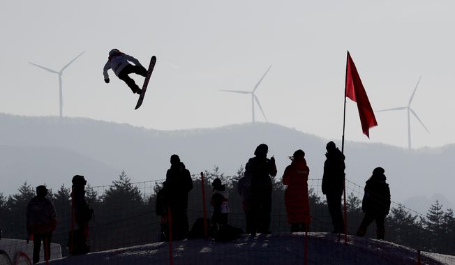 Asami Hirono, of Japan, flies through the air during training for the women&#x27;s big air snowboard competition at the 2018 Winter Olympics in Pyeongchang, South Korea, Monday, Feb. 19, 2018. (AP Photo/Matthias Schrader)