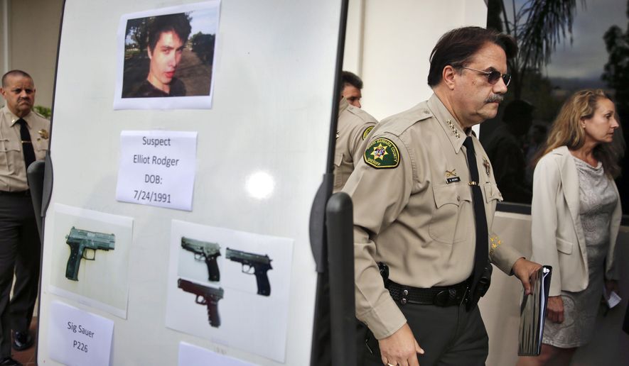 FILE - In this May 24, 2014 file photo, Santa Barbara County Sheriff Bill Brown, right, walks past a board displaying photos of gunman Elliot Rodger and the weapons he used in a mass shooting in Isla Vista, Calif., after a news conference in Santa Barbara, Calif. A growing number of states have passed laws or are considering bills allowing courts to temporarily remove guns from individuals deemed a danger to themselves or others, an intervention that advocates say stops shootings and suicides by disturbed individuals. (AP Photo/Jae C. Hong, File)