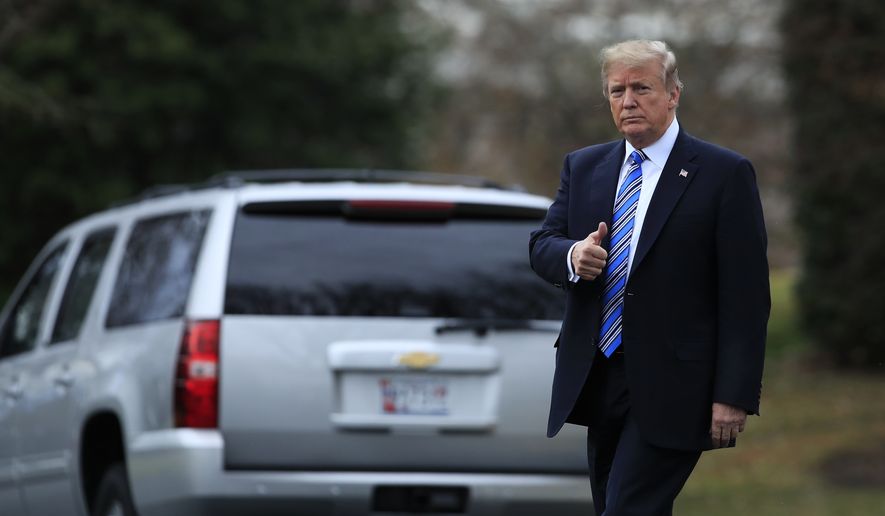 President Donald Trump flashes a thumbs up as he leaves the White House, Friday, Feb. 16, 2018, in Washington. (AP Photo/Manuel Balce Ceneta)