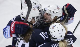 Gigi Marvin (19), of the United States, celebrates with her teammates after scoring a goal against Finland during the first period of the semifinal round of the women&#39;s hockey game at the 2018 Winter Olympics in Gangneung, South Korea, Monday, Feb. 19, 2018. (AP Photo/Julio Cortez)