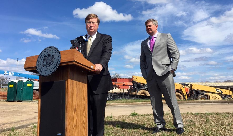 Mississippi Lt. Gov. Tate Reeves and state Sen Joey Fillingane discuss a plan to fund infrastructure improvements on Monday, Feb. 19, 2018, in Jackson, Miss. Reeves says he wants to borrow or divert more than $1 billion over the next six years. (AP Photo/Jeff Amy)