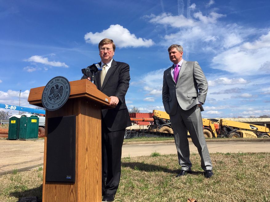 Mississippi Lt. Gov. Tate Reeves and state Sen Joey Fillingane discuss a plan to fund infrastructure improvements on Monday, Feb. 19, 2018, in Jackson, Miss. Reeves says he wants to borrow or divert more than $1 billion over the next six years. (AP Photo/Jeff Amy)