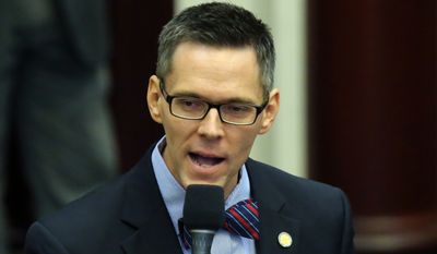 Rep. Ross Spano, R-Dover, speaks in support of an education bill during session, Friday, April 24, 2015, in Tallahassee, Fla.  (AP Photo/Steve Cannon)