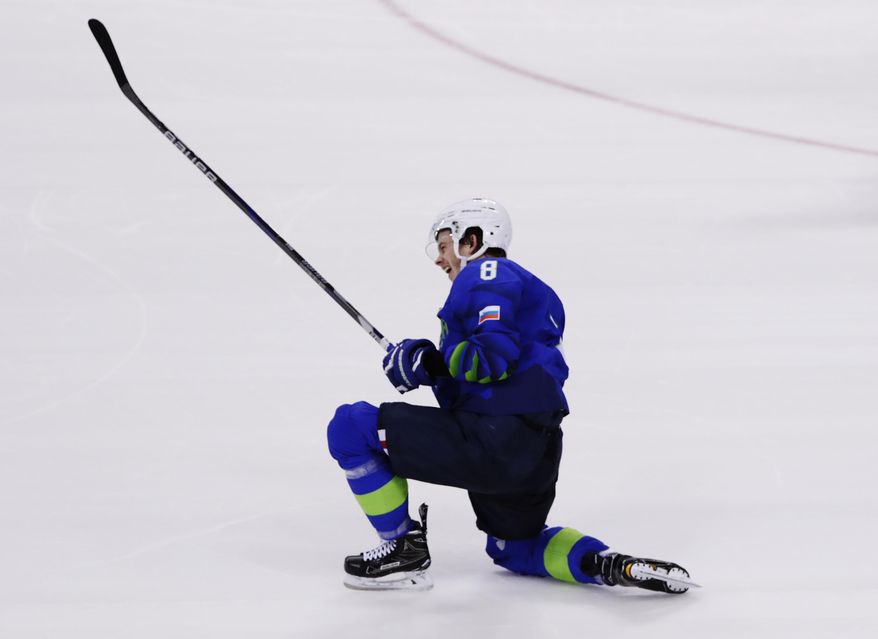 Ziga Jeglic, of Slovenia, celebrates after scoring a goal during the penalty shootout period of the preliminary round of the men&#39;s hockey game against Slovakia at the 2018 Winter Olympics in Gangneung, South Korea, Saturday, Feb. 17, 2018. (AP Photo/Frank Franklin II)