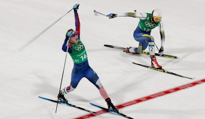 American Jessica Diggins celebrates as she crosses the finish line past Sweden&#x27;s Stina Nilsson to win the United States&#x27; first medal ever in the women&#x27;s team sprint freestyle cross-country skiing at the Winter Olympics in Pyeongchang, South Korea, on Wednesday. (ASSOCIATED PRESS PHOTOGRAPHS)