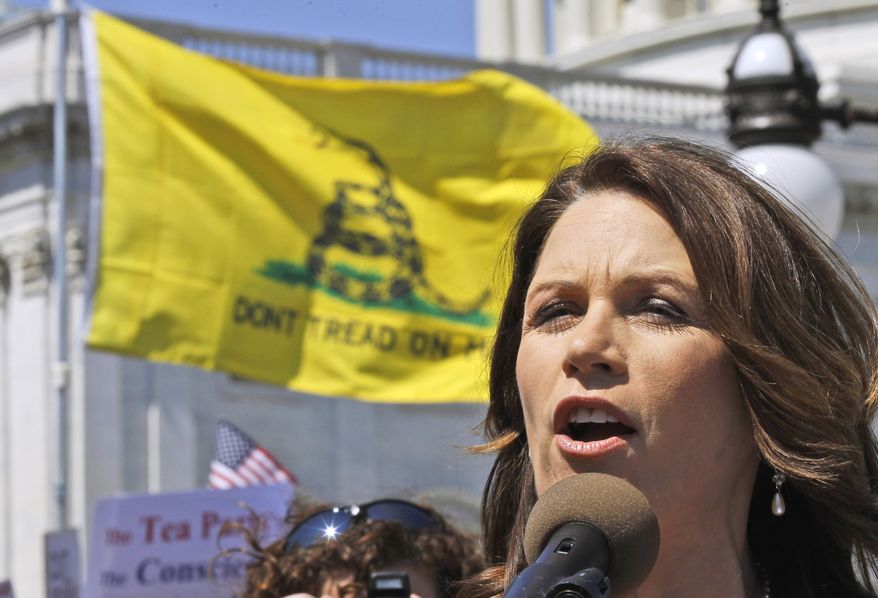 FILE - In this April 6, 2011 file photo, Rep. Michele Bachmann, R-Minn. addresses an Americans for Prosperity "Cut Spending Now," rally on Capitol Hill in Washington. It’s the weird issue that won’t go away, and it’s forcing GOP presidential contenders and other Republican leaders to pick sides: do they think President Obama was born outside the United States and is therefore disqualified to be president? Polls show that a remarkable two-thirds of all Republican voters either think Obama was born abroad or they aren’t sure. With Donald Trump stirring the pot, other potential candidates are distancing themselves from his comments to varying degrees. (AP Photo/Alex Brandon, File)