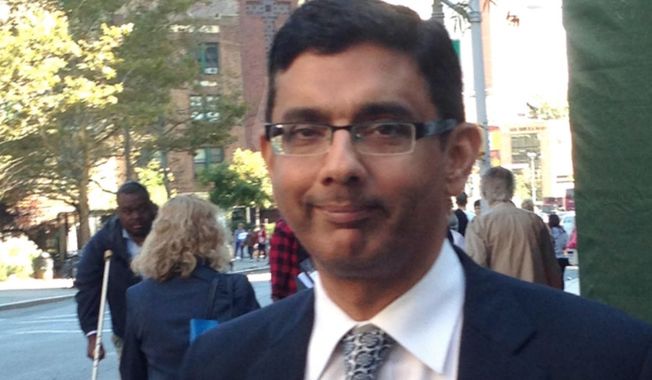 Dinesh D&#x27;Souza leaves federal court in New York, Tuesday, Sept. 23, 2014, after being sentenced to spend eight months in community confinement and undergo therapeutic counseling for arranging straw donors for a Senate candidate. D&#x27;Souza was spared from prison even though U.S. District Judge Richard M. Berman said the defendant continues to deflect responsibility and minimize his crime. (AP Photo/Larry Neumeister) ** FILE **