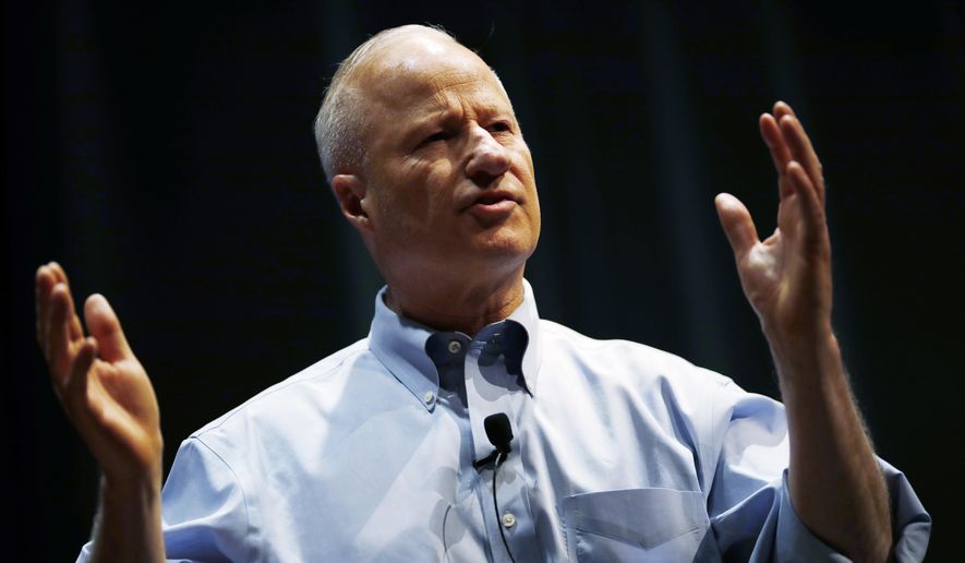U.S. Rep. Mike Coffman, R-Colorado, talks during a town hall meeting with constituents in a high school assembly hall Tuesday, Feb. 20, 2018, in Greenwood Village, Colo. (AP Photo/David Zalubowski)