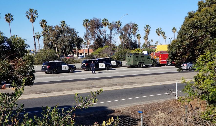 Ventura Police Department and Ventura Fire Department are parked along with California Highway Patrol on Interstate 101, Wednesday, Feb. 21, 2018, in Ventura, Calif. A rape suspect died after drinking cyanide during a freeway chase in Southern California on Wednesday, authorities said. Jonathan Hanks, 33, of Camarillo, was pulled from his car and pronounced dead at the scene on Interstate 101. (Christian Martinez/The Ventura County Star via AP)
