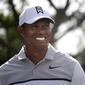 Tiger Woods smiles as he jokes with his playing partners during the Pro-Am for the Honda Classic golf tournament, Wednesday, Feb. 21, 2018, in Palm Beach Gardens, Fla.  (Joe Cavaretta/South Florida Sun-Sentinel via AP)