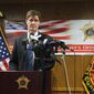In this Feb. 12, 2018, file photo, District Attorney John Chisholm discusses criminal charges he filed against three county jail staffers in Milwaukee, for the dehydration death of an inmate in 2016. The Milwaukee District Attorney&#39;s Office on Wednesday, Feb. 21, 2018, charged Miami-based Armor Correctional Health Services Inc. with seven misdemeanor counts of intentionally falsifying health records. The company is the latest defendant to face charges in the death of Thomas. (AP Photo/Ivan Moreno) ** FILE **