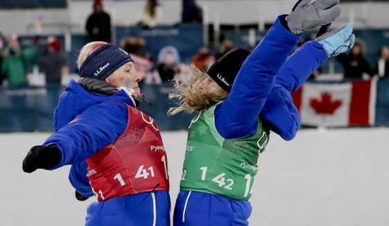 United States&#39; Jessica Diggins, right, and Kikkan Randall celebrate after winning the gold medal in the women&#39;s team sprint freestyle cross-country skiing final at the 2018 Winter Olympics in Pyeongchang, South Korea, Wednesday, Feb. 21, 2018. (AP Photo/Matthias Schrader)
