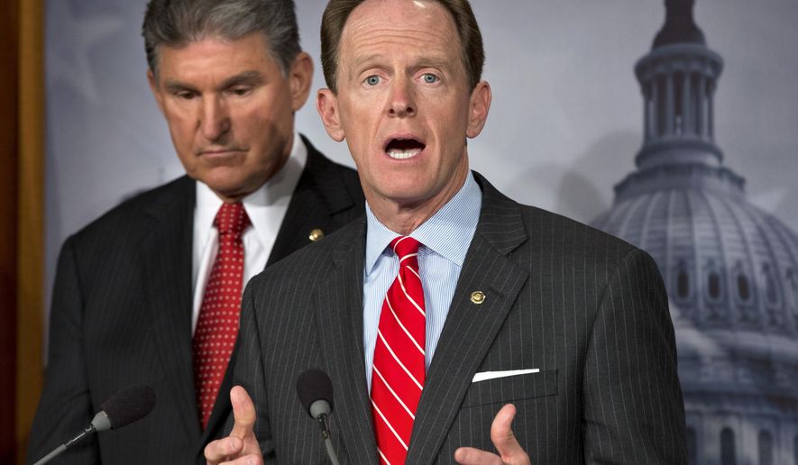 FILE - In this April 10, 2013, file photo, U.S. Sen. Patrick Toomey, R-Pa., right, speaks alongside U.S. Sen. Joe Manchin, D-W.Va., left, as they discuss reaching a bipartisan agreement that would expand background checks to more gun buyers, during a news conference on Capitol Hill in Washington. Toomey said Wednesday, Feb. 21, 2018, that he&#39;ll probably reintroduce legislation to expand background checks on gun purchases, but that the proposal may require changes compared to previous efforts that failed at least twice. The bill never exceeded 54 votes, short of the 60 necessary. (AP Photo/J. Scott Applewhite, File)