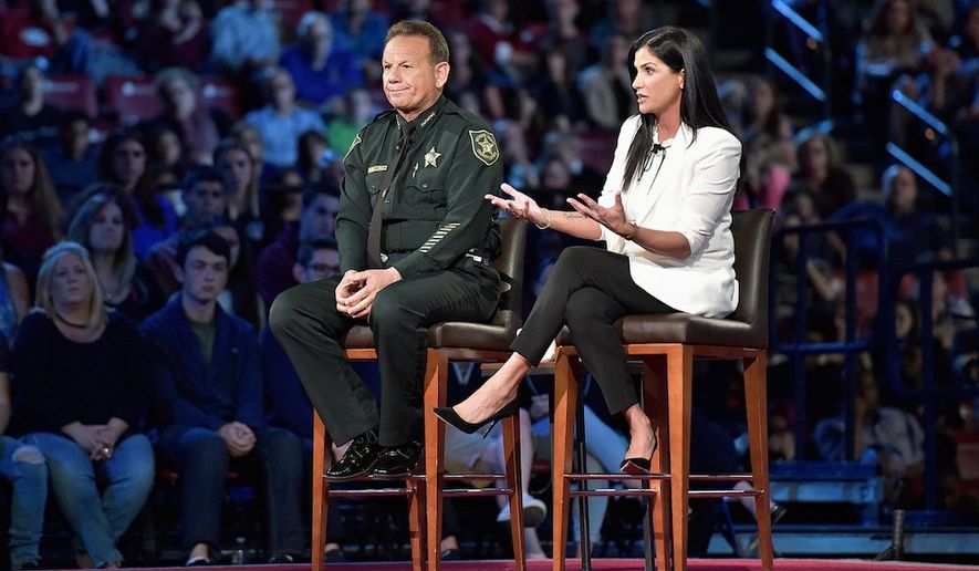 NRA spokeswoman Dana Loesch fields questions, sitting next to Broward Sheriff Scott Israel during a CNN town hall meeting. (Associated Press)