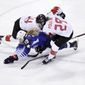 Gigi Marvin (19), of the United States, collides between Renata Fast (14), of Canada, and Marie-Philip Poulin (29), of Canada, during the first period of the women&#39;s gold medal hockey game at the 2018 Winter Olympics in Gangneung, South Korea, Thursday, Feb. 22, 2018. (AP Photo/Matt Slocum)
