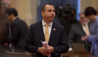 Democratic State Sen. Tony Mendoza stands on the floor of the Senate chambers in between private meetings of the Democratic caucus, Wednesday, Jan. 3, 2018, in Sacramento, Calif. Mendoza&#x27;s colleagues debated whether to suspend him amid a sexual misconduct investigation during the opening day of the Senate. (AP Photo/Steve Yeater)