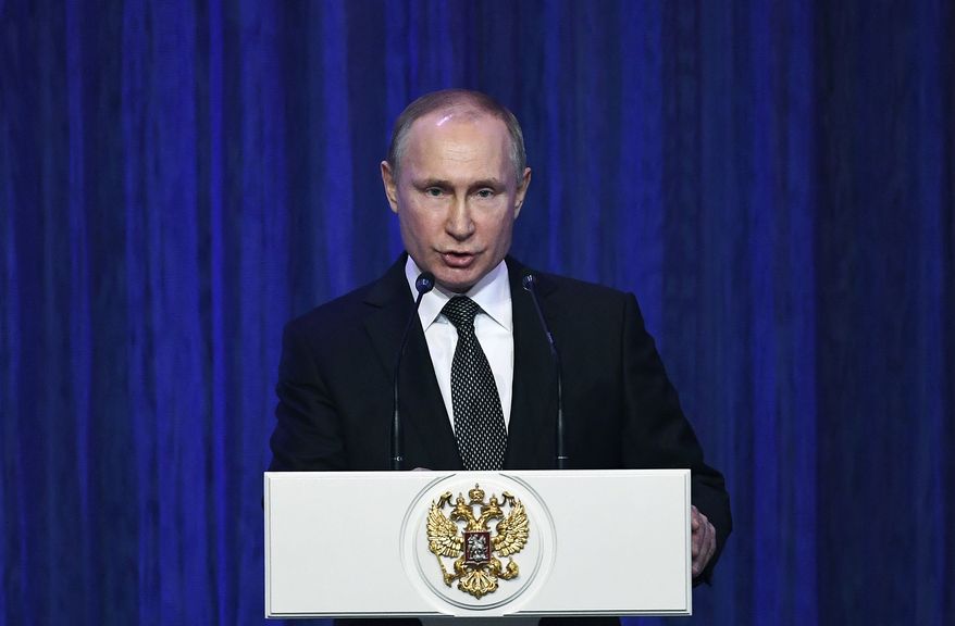 Russian President Vladimir Putin delivers his speech at the Grand Kremlin Palace marking the Defender of the Fatherland Day in Moscow, Russia, Thursday, Feb. 22, 2018. (Yuri Kadobnov/Pool Photo via AP)
