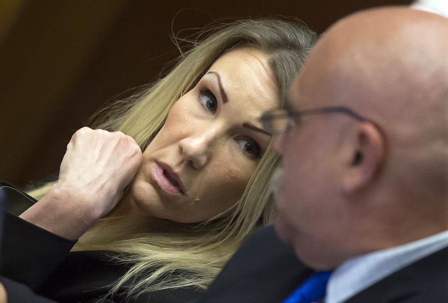 FILE - In this Sept. 14, 2017 file photo, Sabrina Limon confers with her attorney Richard Terry during her murder trial in Bakersfield, Calif. Limon, who was convicted of conspiring with her lover to kill her husband has been sentenced to 25 years to life in prison. A jury in Bakersfield last year found her guilty of murder, conspiracy to commit murder and other charges. The judge handed down the sentence Wednesday, Feb. 21, 2018, after denying a motion for a new trial.(Felix Adamo/The Bakersfield Californian via AP, File)