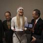 United States&#39; Lindsey Vonn, center, smiles as she receives gifts and a letter of appreciation for her grandfather&#39;s service during the Korean War from members of the Yongsan Club in Jeongseon, South Korea, Thursday, Feb. 22, 2018. (AP Photo/Felipe Dana)