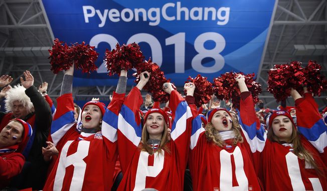 Russian fans cheer while watching the quarterfinal round of the men&#x27;s hockey game between Norway and the team from Russia at the 2018 Winter Olympics in Gangneung, South Korea, Wednesday, Feb. 21, 2018. (AP Photo/Jae C. Hong)