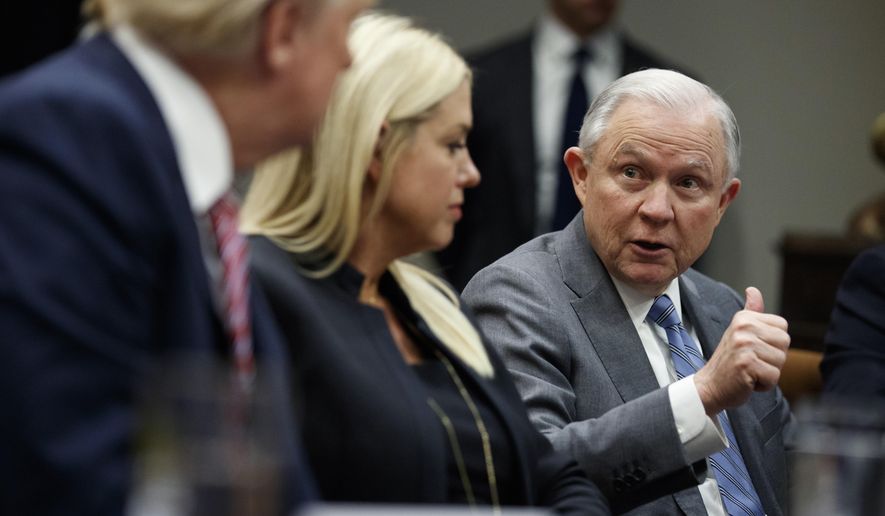 President Donald Trump, left, and Florida Attorney General Pam Bondi, center, listen as Attorney General Jeff Sessions speaks during a meeting with state and local officials to discuss school safety in the Roosevelt Room of the White House, Thursday, Feb. 22, 2018, in Washington. (AP Photo/Evan Vucci)