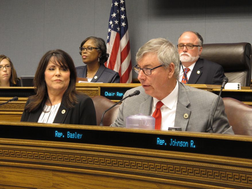 Rep. Larry Bagley, R-Stonewall, asks questions about a Medicaid bill while Rep. Dodie Horton, R-Haughton listens during a hearing of the House Health and Welfare Committee on Thursday, Feb. 22, 2018, in Baton Rouge, La. (AP Photo/Melinda Deslatte)