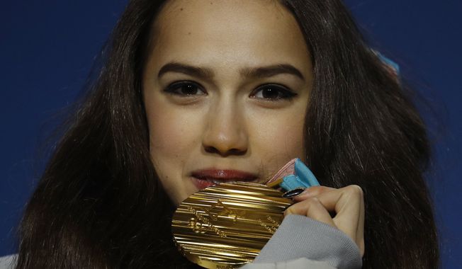 Gold medalist in the women&#x27;s free figure skating Russian athlete Alina Zagitova poses during the medals ceremony at the 2018 Winter Olympics in Pyeongchang, South Korea, Friday, Feb. 23, 2018. (AP Photo/Charlie Riedel)