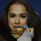 Gold medalist in the women&#39;s free figure skating Russian athlete Alina Zagitova poses during the medals ceremony at the 2018 Winter Olympics in Pyeongchang, South Korea, Friday, Feb. 23, 2018. (AP Photo/Charlie Riedel)