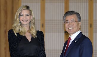 South Korean President Moon Jae-in shakes hands with Ivanka Trump during their dinner at the Presidential Blue House on Friday, Feb. 23, 2018, Seoul, South Korea. Ivanka Trump has received a red-carpet welcome in South Korea as head of the U.S. delegation to this weekend&#39;s closing ceremony for the Winter Olympics in Pyeongchang. (Kim Min-Hee/Pool Photo via AP)