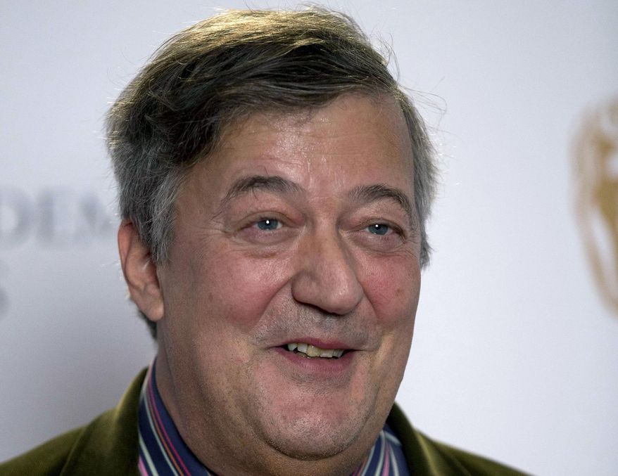 FILE - In this Friday, Jan. 9, 2015 file photo, British actor and comedian Stephen Fry poses for photographers during a photocall to mark the announcement of the BAFTA (British Academy of Film and Television Arts) award nominations in London. British comedian and actor Stephen Fry has revealed that he is suffering from prostate cancer. The 60-year-old Fry said Friday Feb. 23, 2018 on his Twitter page that he has been fighting the disease for the past two months. (AP Photo/Matt Dunham, File)