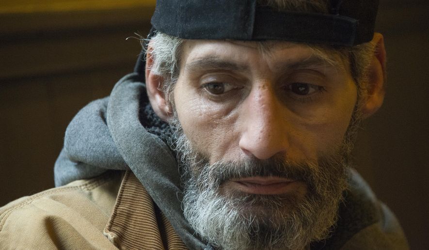 ADVANCE FOR RELEASE SATURDAY, FEBRUARY 24, 2018 Kate Giammarise Local Ira Trageser, of Crafton is pictured at Crazy Mocha on Tuesday, January 30, 2018 in downtown. He was illegally jailed for failure to pay court costs. (Lake Fong/Pittsburgh Post-Gazette via AP)