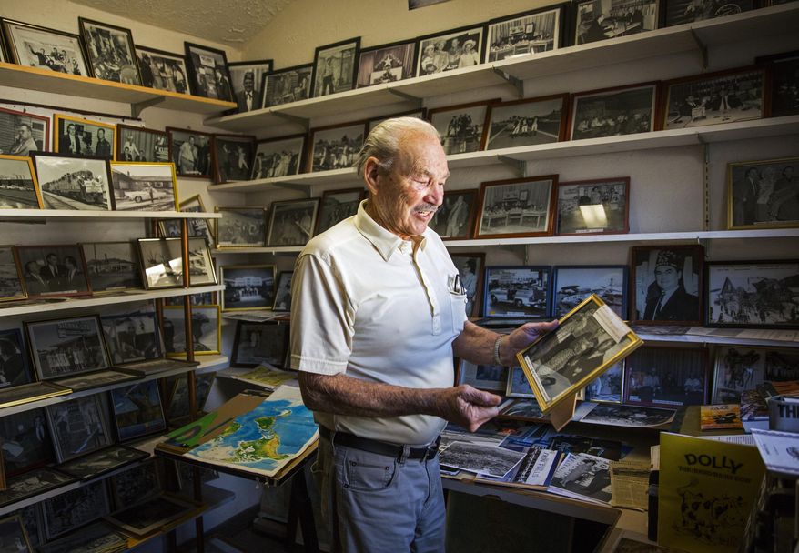 In this Feb. 17, 2018 photo, photographer Vic Graybeal, 94, shows off a picture he took of musician Louis Armstrong and movie star Sheila McCrea at his home in Twin Falls Idaho. Graybeal has outlived most of the folks he photographed over the years, celebrities including Marilyn Monroe and Louis Armstrong, and Twin Falls locals Clarence Smith and grocer Joe Shelby, to name a few. (Pat Sutphin/The Times-News via AP)