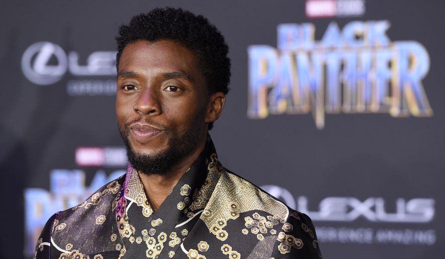 FILE - In this Jan. 29, 2018 file photo, Chadwick Boseman, a cast member in &amp;quot;Black Panther,&amp;quot; poses at the premiere of the film at The Dolby Theatre in Los Angeles. The language of Wakanda in “Black Panther” is very much real, including the “click” sounds that are making audiences murmur, impressed. That’s thanks to South African actor and cast member John Kani, who introduced the idea of using it with his onscreen son, Chadwick Boseman. (Photo by Chris Pizzello/Invision/AP, File)