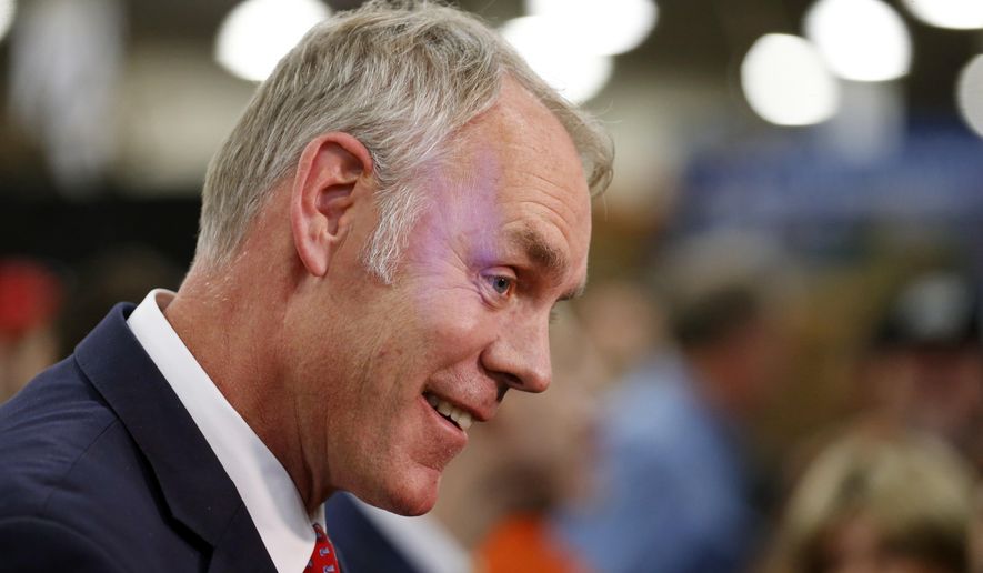 In this Feb. 9, 2018, file photo, U.S. Interior Secretary Ryan Zinke speaks to reporters at a conservation announcement at the Western Conservation and Hunting Expo in Salt Lake City. (AP Photo/Rick Bowmer, File) **FILE**