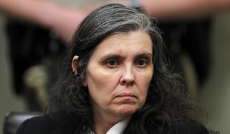 In this Jan. 24, 2018, file photo, Louise Turpin appears in court in Riverside, Calif. David and Louse Turpin, who are charged with torturing their children by starving, beating and shackling them, are scheduled to appear Friday, Feb. 23, 2018, in a Riverside courtroom for a conference about their case. (Mike Blake/Pool Photo via AP, File)