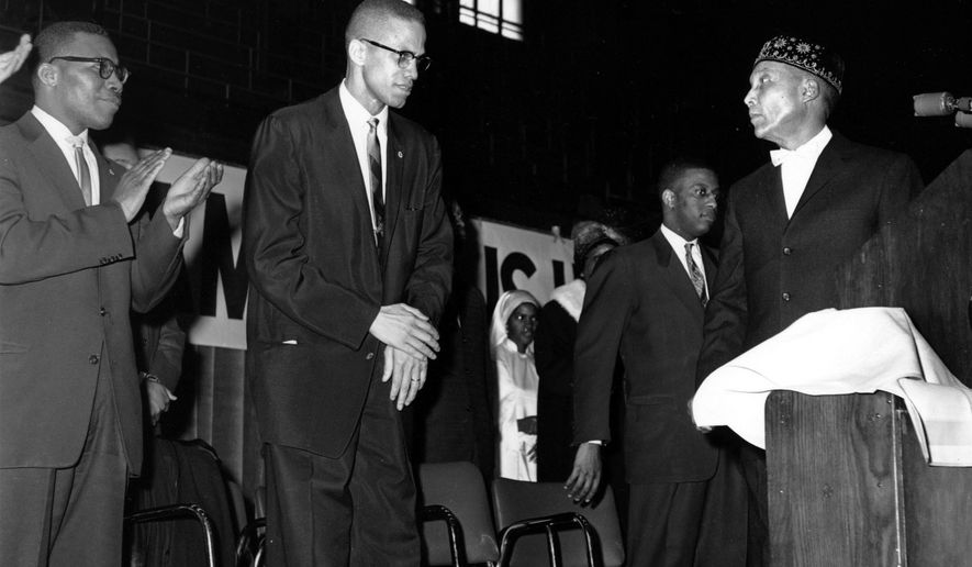 FILE - In this Feb. 26, 1961 file photo, Elijah Muhammad, founder and head of the Nation of Islam, right, introduces Malcolm X in Chicago. A Smithsonian Channel series, &amp;quot;The Lost Tapes: Malcolm X,” examining the life of civil right leader Malcolm X, follows the advocate’s changing philosophy using his own words as a Nation of Islam surrogate to a figure seeking to build coalitions during the tumultuous 1960s civil rights era. (AP Photo/Paul Cannon, File)