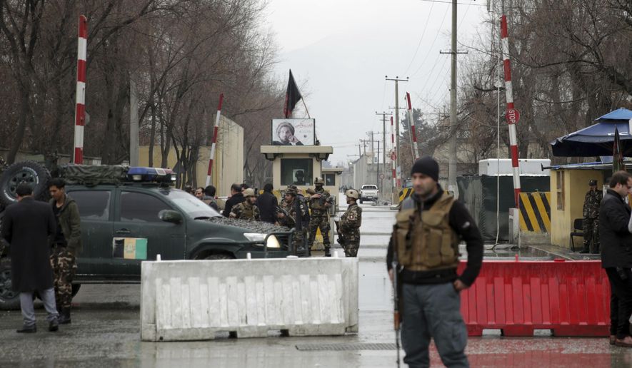 Security forces inspect the site of a suicide bombing in the diplomatic area of capital Kabul, Afghanistan, Saturday, Feb. 24, 2018. Interior ministry spokesman Najib Danish said several people were wounded in Saturday's attack in the Shash Darak area of Kabul, near NATO headquarters and not far from the U.S. Embassy. (AP Photo/Massoud Hossaini)