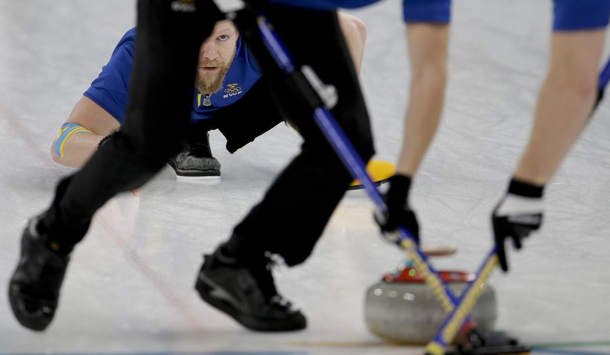 Sweden&#39;s skip Niklas Edin watches his teammates sweep the ice during the men&#39;s final curling match against THE United States at the 2018 Winter Olympics in Gangneung, South Korea, Saturday, Feb. 24, 2018. (AP Photo/Natacha Pisarenko)